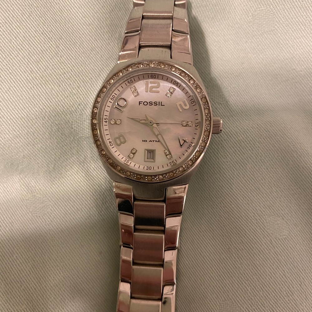 Small silver fossil watch